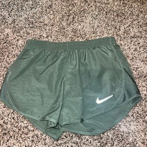 Green Nike running shorts
